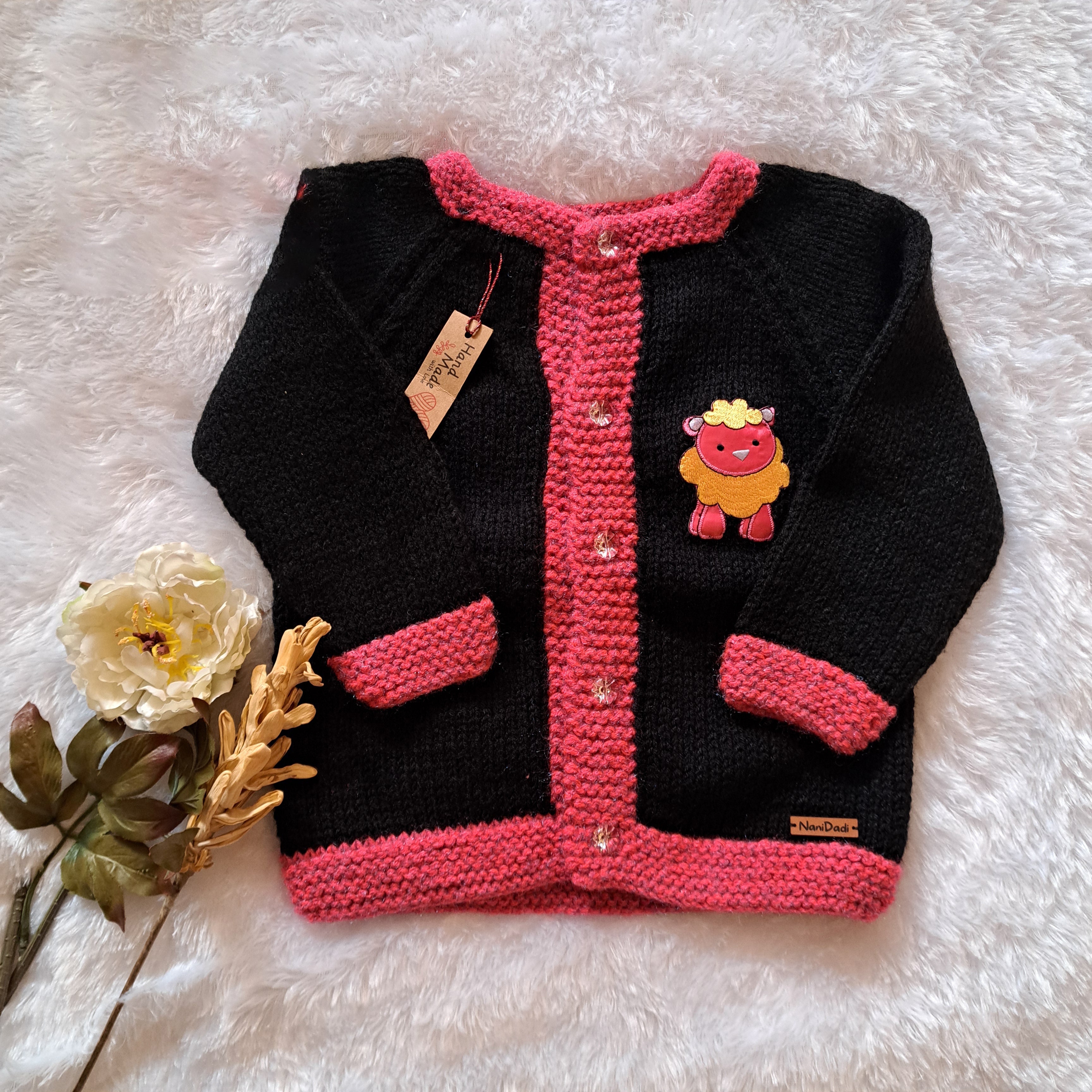 beautiful black and pink combination sweater, perfect for 4-year-old