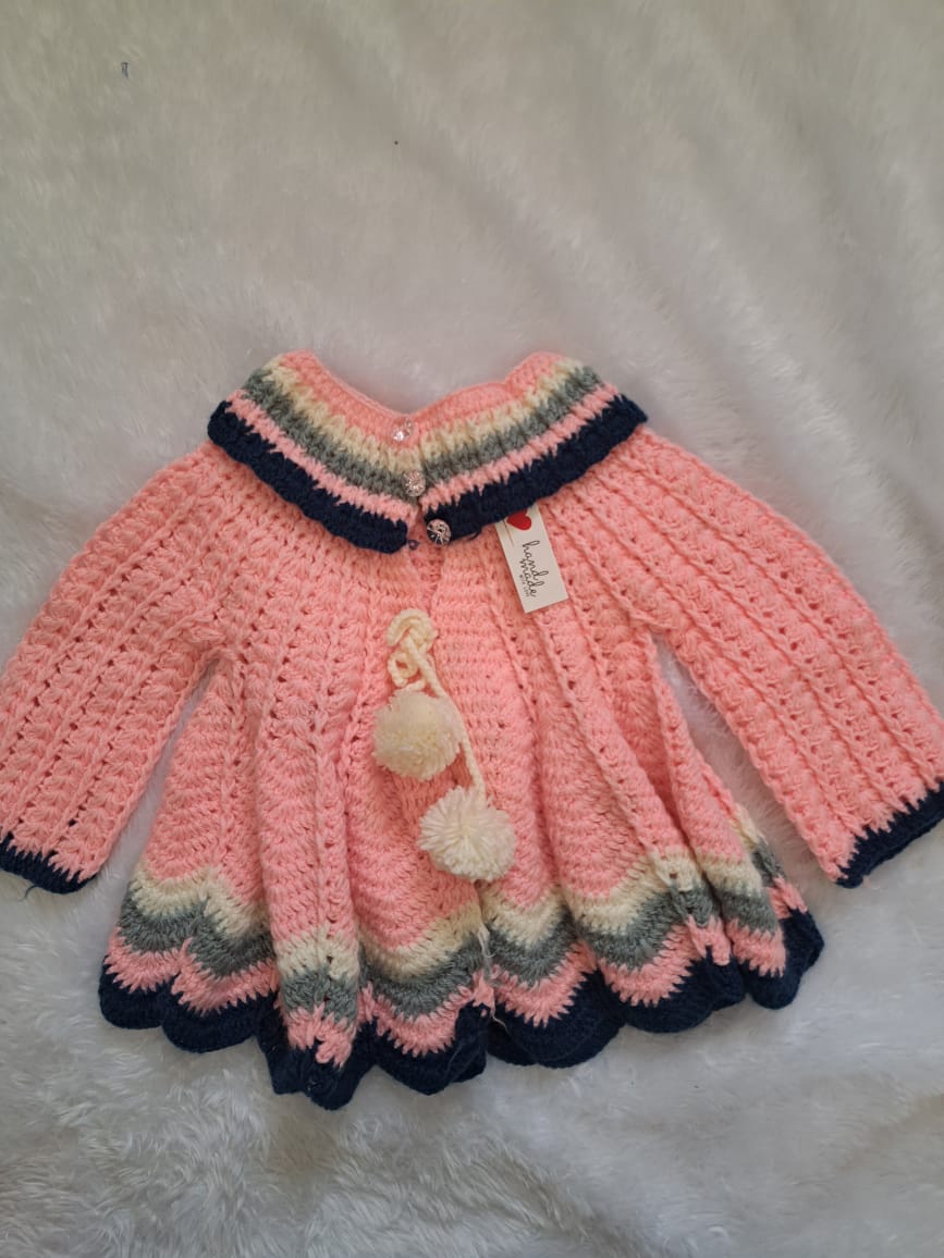 Handmade Pink crochet jacket dress. With border
